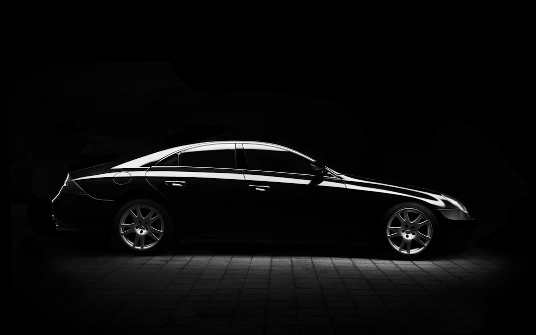 Premium dark luxury sedan used to preview AUTOVA window tint shades